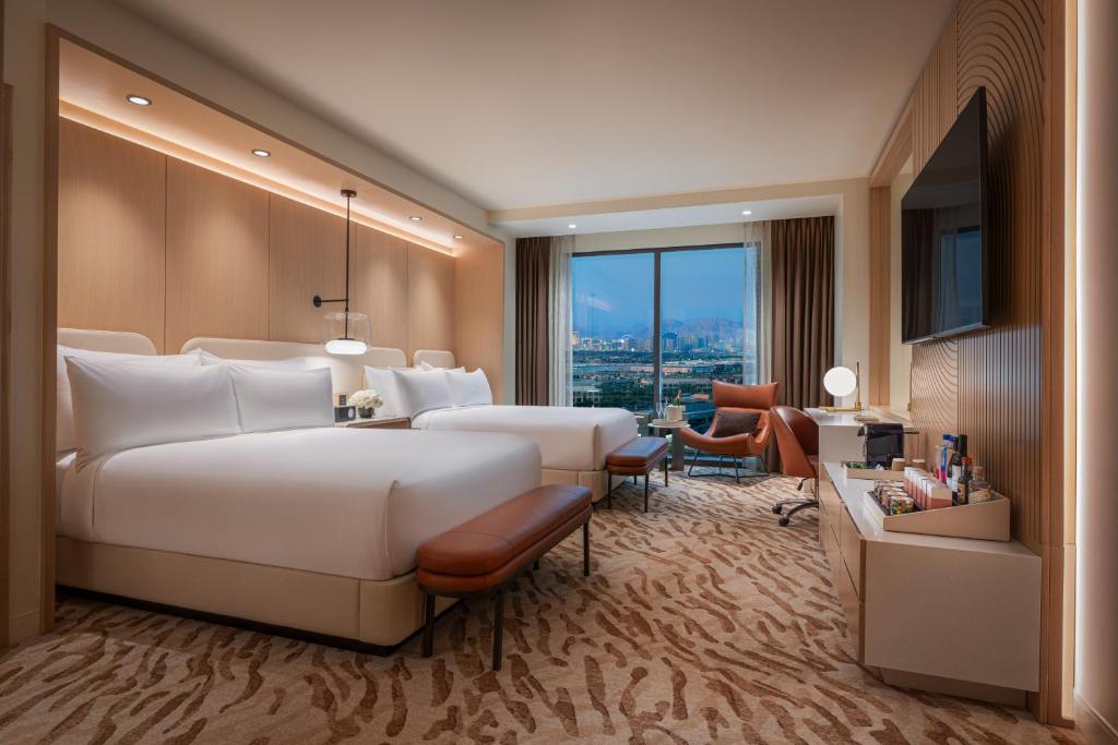 Ein Bett oder Betten in einem Zimmer der Unterkunft Durango Casino &amp; Resort