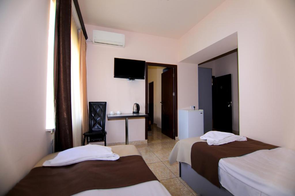 Postel nebo postele na pokoji v ubytování Comfort House Hotel