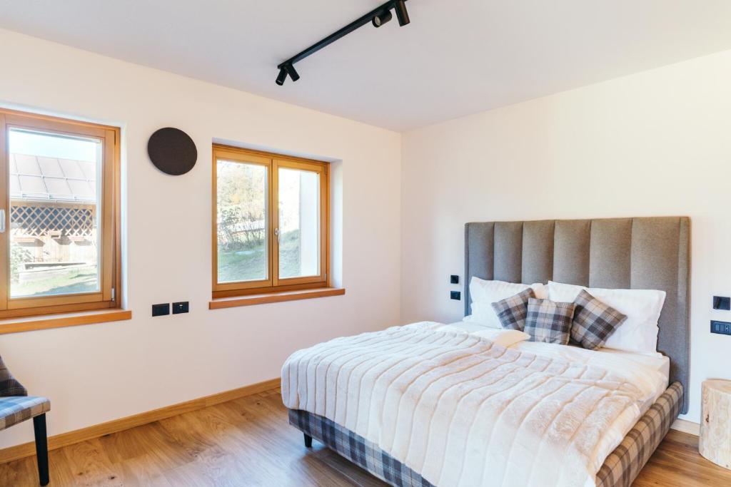 Postel nebo postele na pokoji v ubytování Chalet M