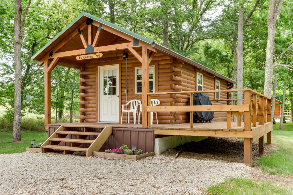 a log cabin with a porch and a deck at Idyllic Florence Cabin with Grill and Creek Views in Florence