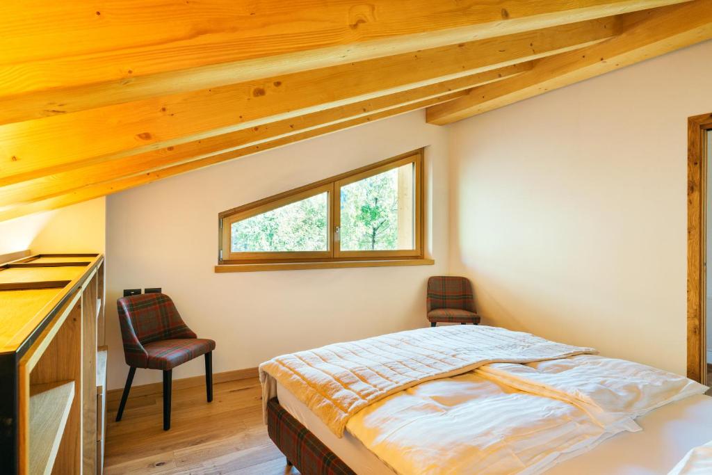 Postel nebo postele na pokoji v ubytování Chalet M