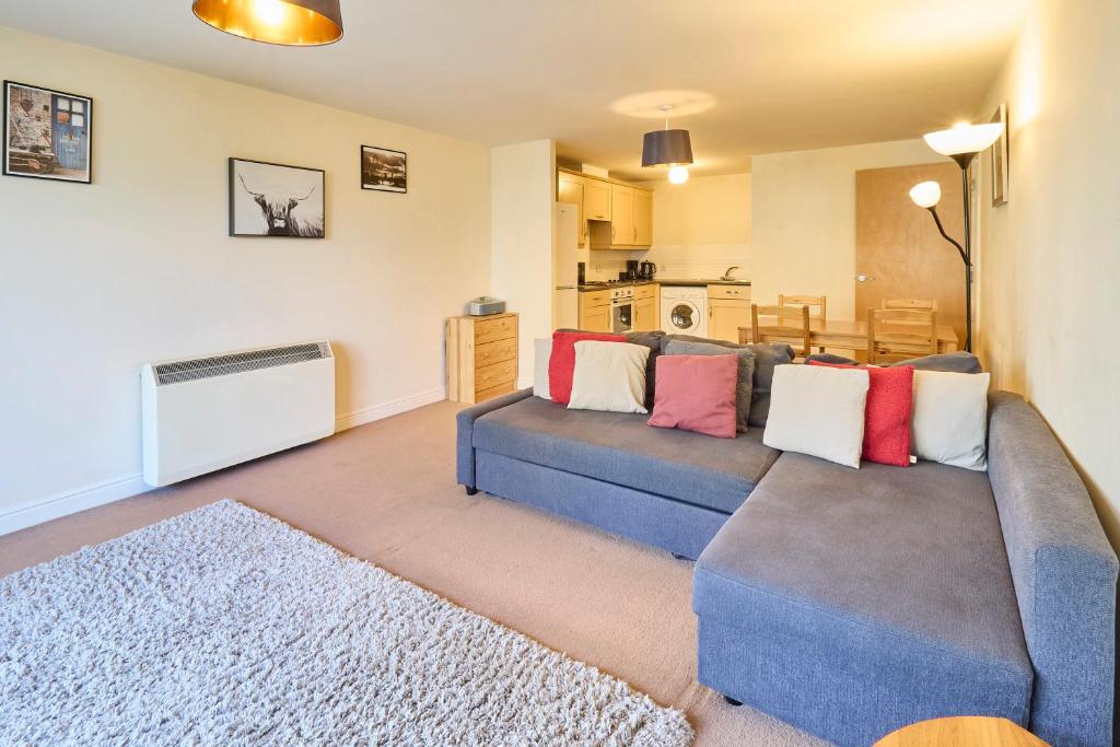 a living room with a couch and a table at Host & Stay - Bingley Court in Canterbury