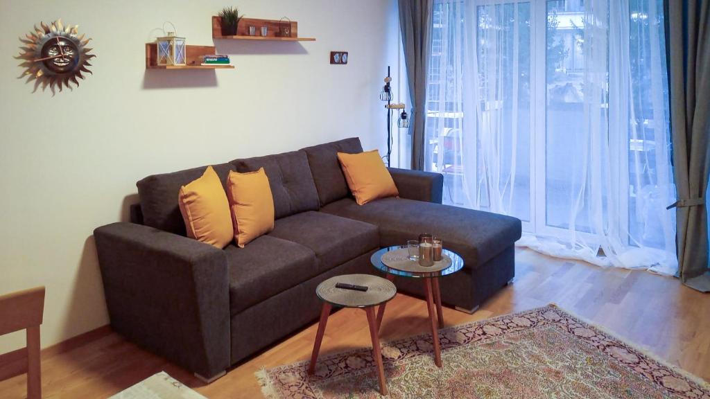 a living room with a couch and a table at Große Wohnung mitten in St. Moritz am See in St. Moritz