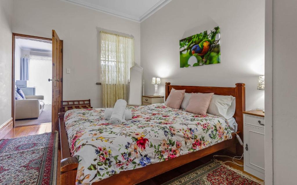 a bedroom with a bed with a comforter on it at BIG4 Cape Jervis Accommodation & Caravan Park in Cape Jervis