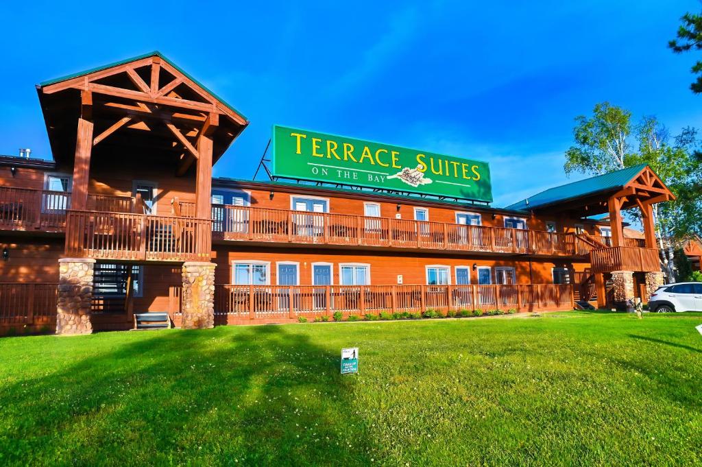 a hotel with a sign that reads terrace suites on the way at Terrace Suites in Callander