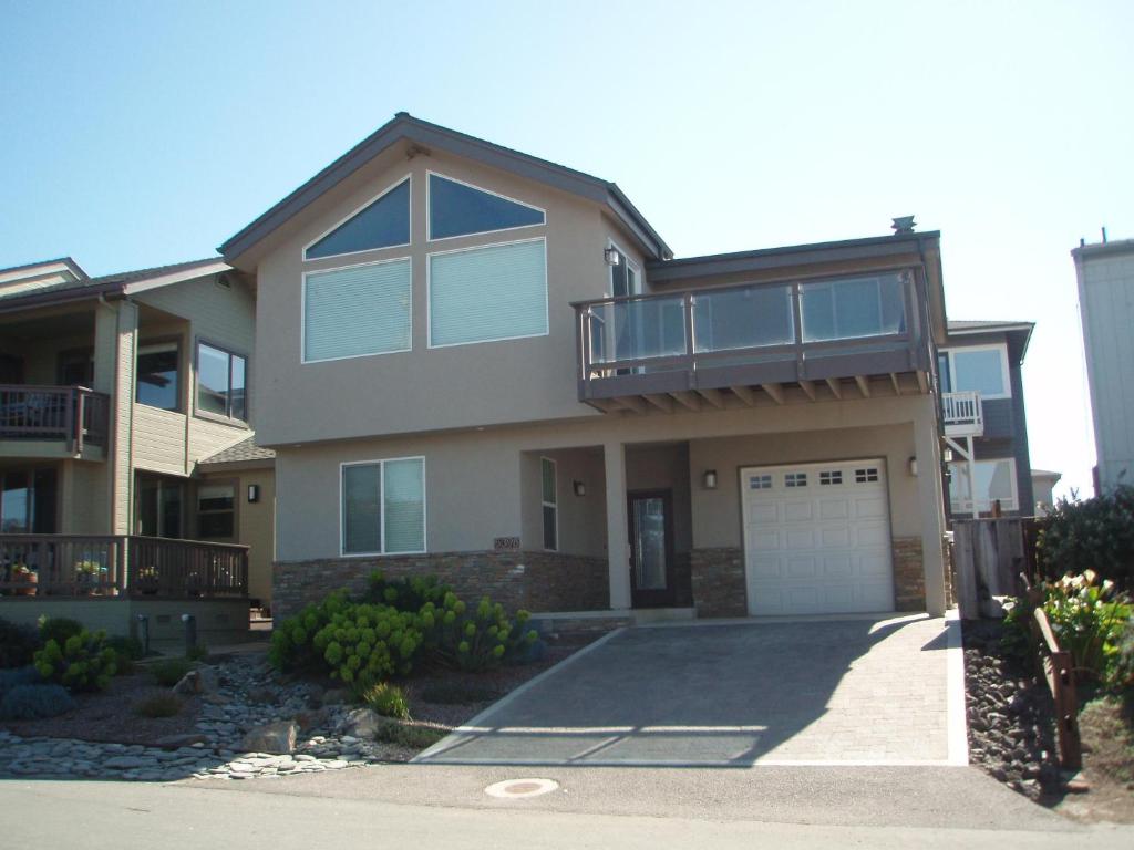 a large house with a balcony and a driveway at 5398 Nottingham in Cambria