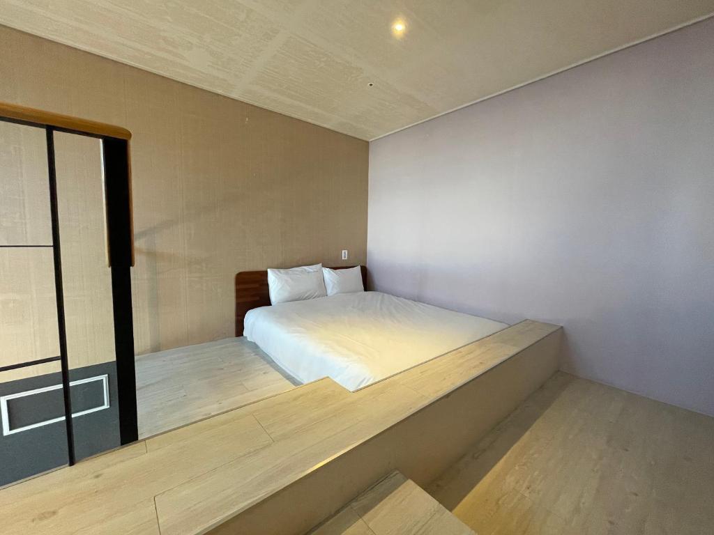 Postel nebo postele na pokoji v ubytování Elysia Boutique Hotel