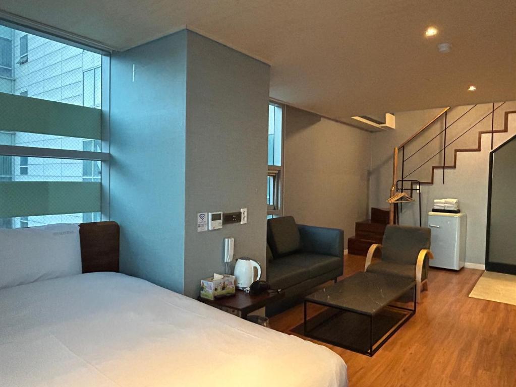 Postel nebo postele na pokoji v ubytování Elysia Boutique Hotel