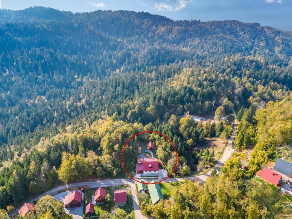 an aerial view of a house in the middle of a forest at Family friendly house with a parking space Brestova Draga, Gorski kotar - 21977 in Delnice