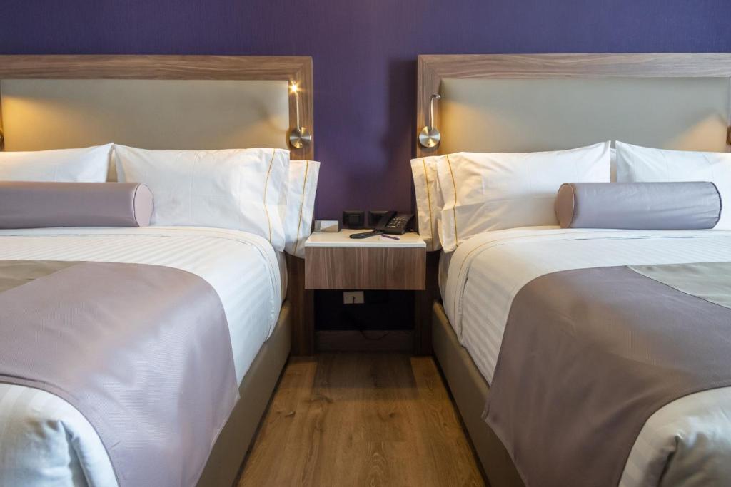 Postel nebo postele na pokoji v ubytování Sheraton Guadalajara Expo