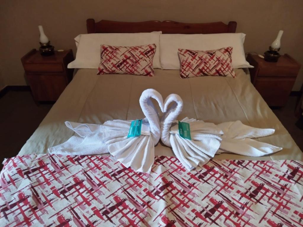 En eller flere senger på et rom på Gran Hotel Huerta Grande