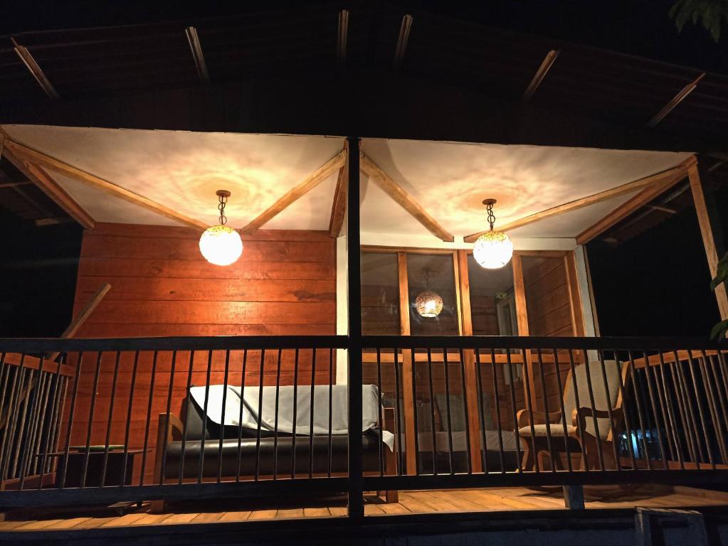 a screened in porch of a house at night at Hotel Rancho El Vergel in Montenegro
