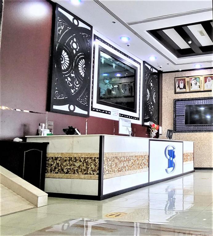 TV a/nebo společenská místnost v ubytování SHH Hotel