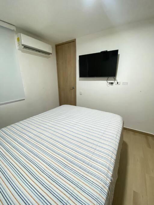 TV a/nebo společenská místnost v ubytování Hermoso apartamento nuevo en Barranquilla