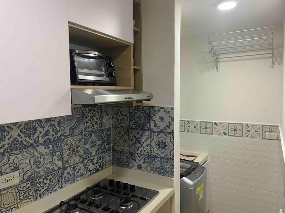 Kuchyň nebo kuchyňský kout v ubytování Hermoso apartamento nuevo en Barranquilla