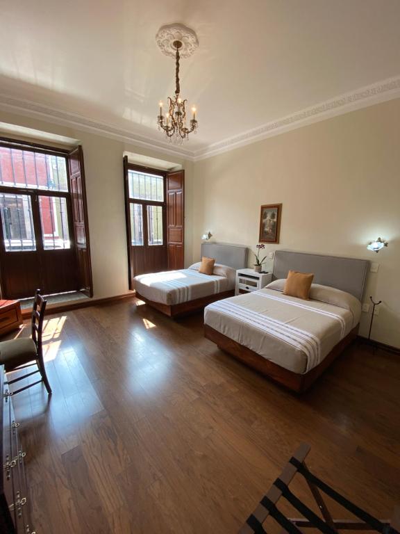 Postel nebo postele na pokoji v ubytování Hotel Cantera Real, Morelia
