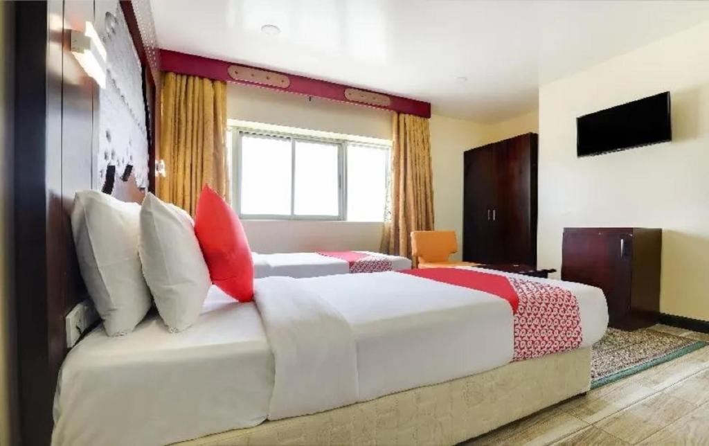 Postel nebo postele na pokoji v ubytování SHH Hotel