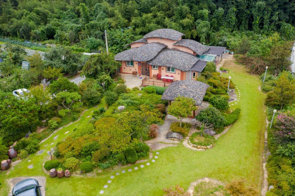 an aerial view of a house with a garden at Songjukheon Pension in Damyang