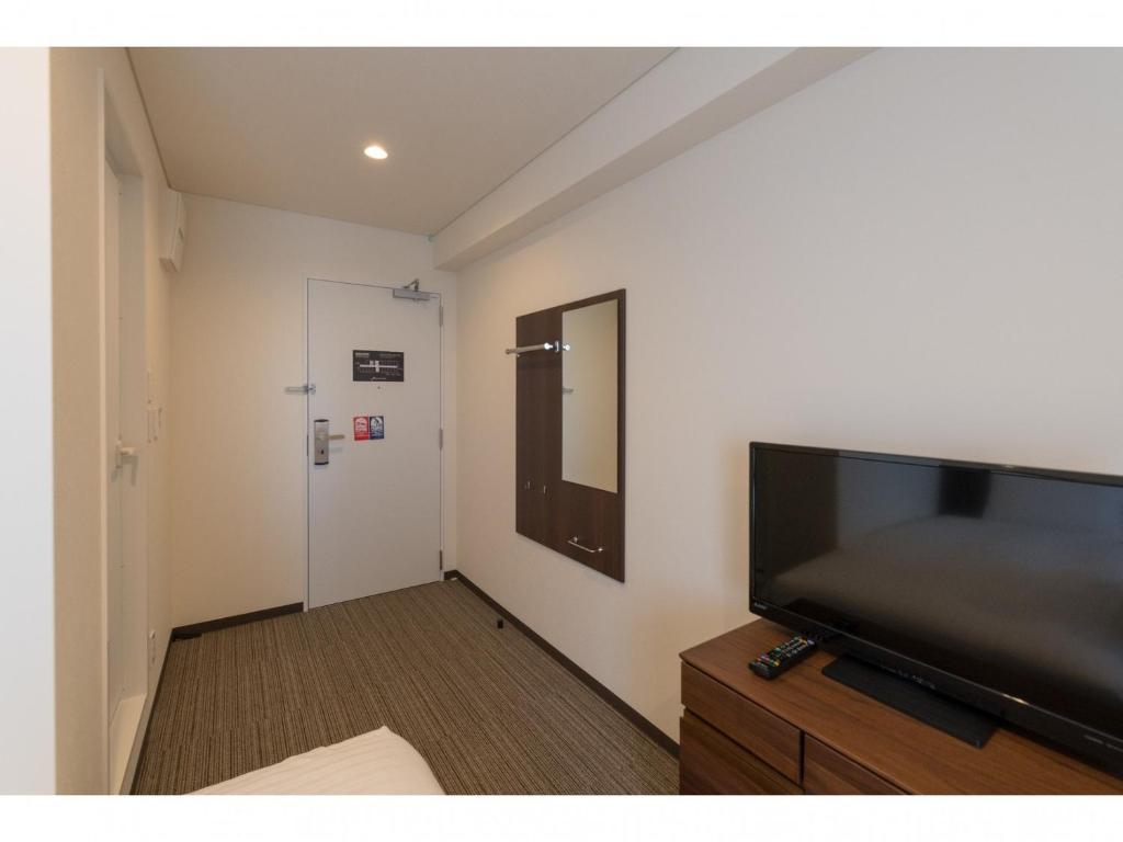 TV a/nebo společenská místnost v ubytování Bande Hotel Osaka