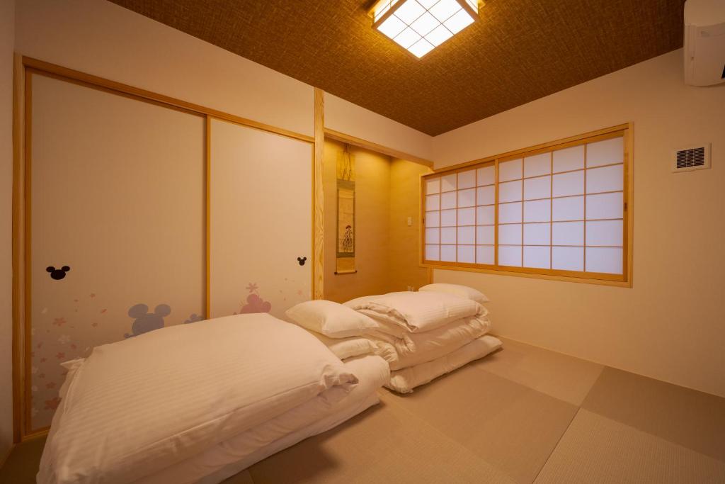 Postel nebo postele na pokoji v ubytování 旅の宿 花景色 Tabi no yado Hanageshiki