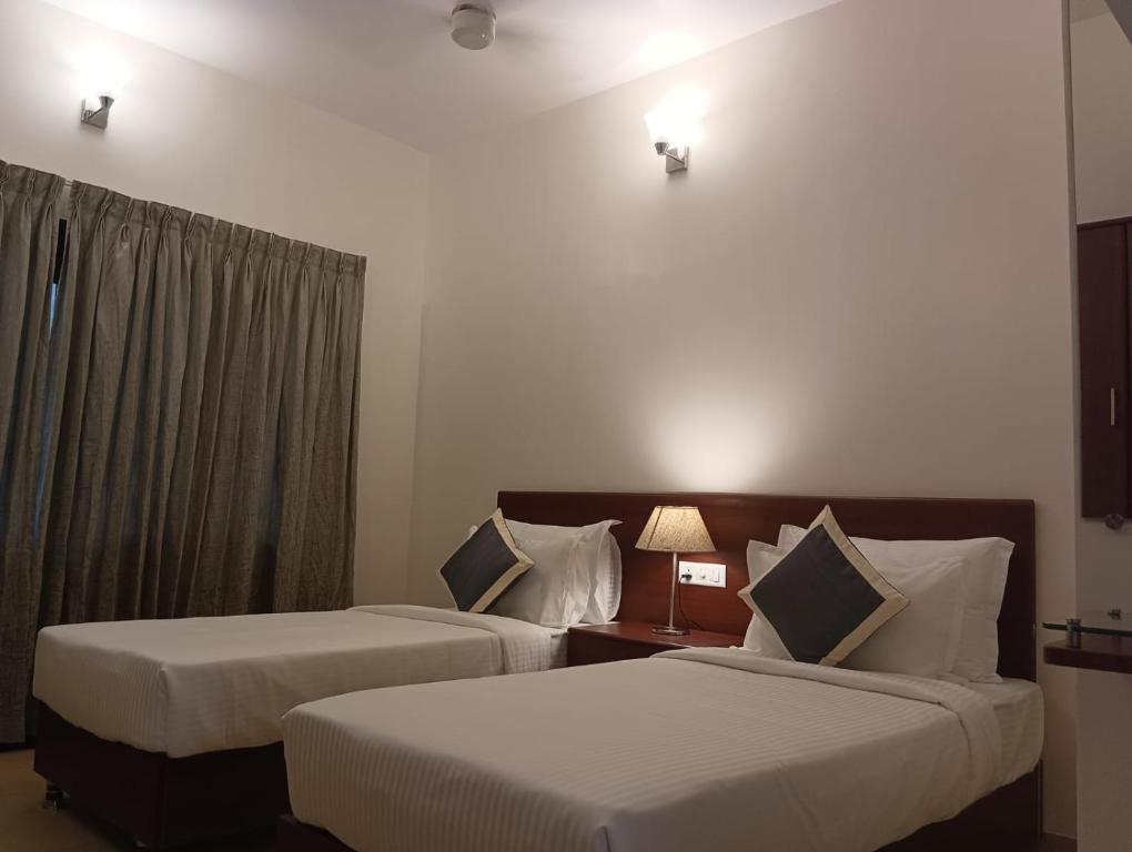 Postel nebo postele na pokoji v ubytování Le MIAMI RESORT