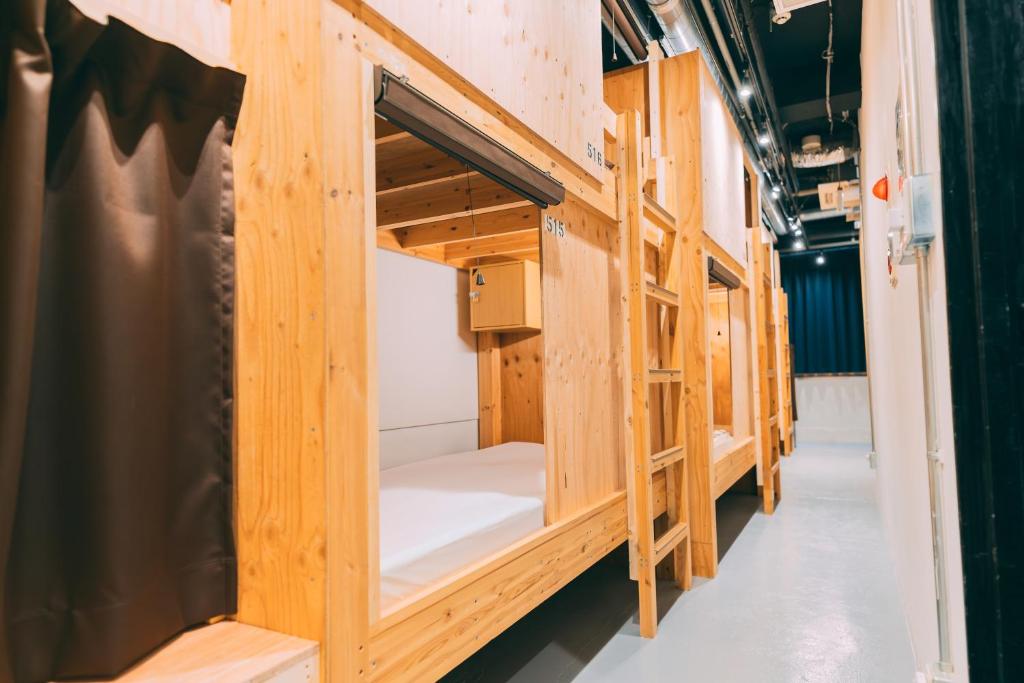Postel nebo postele na pokoji v ubytování Tokyo Guesthouse HIVE