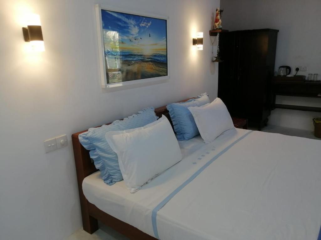 Postel nebo postele na pokoji v ubytování Jennifer's Villa