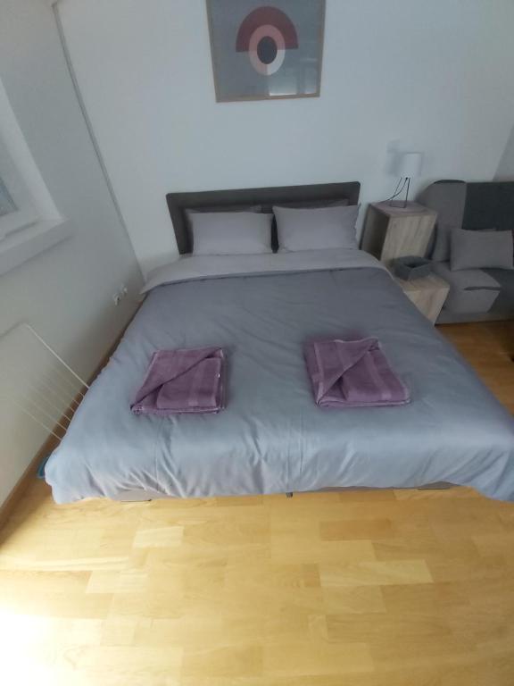 Postel nebo postele na pokoji v ubytování Apartman NALE