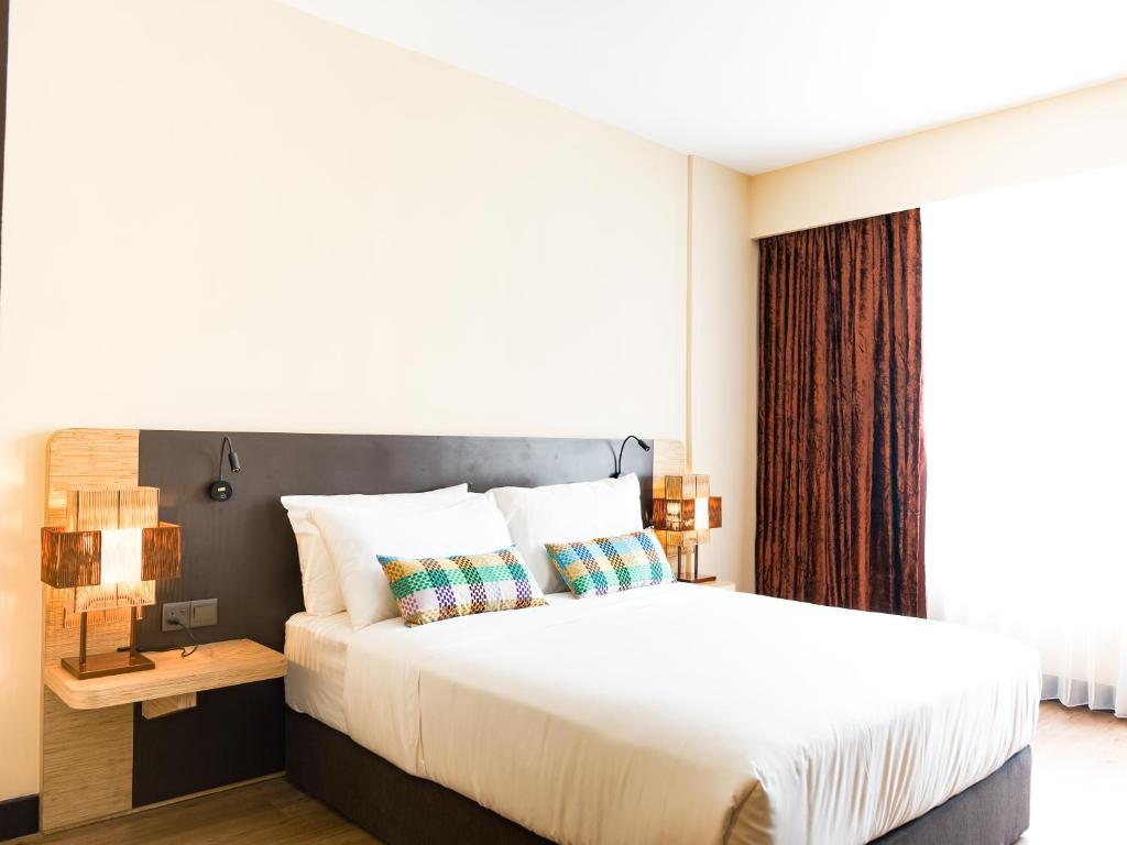 Postel nebo postele na pokoji v ubytování Starus Hotel Bukit Bintang