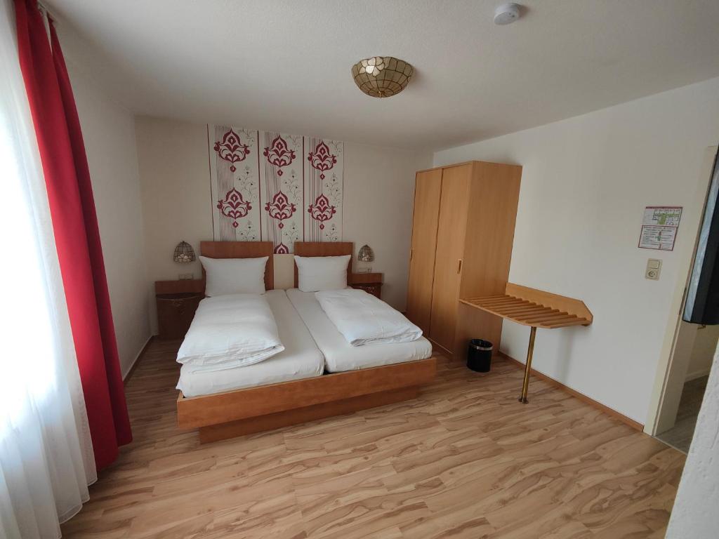 Postel nebo postele na pokoji v ubytování Hotel Linden