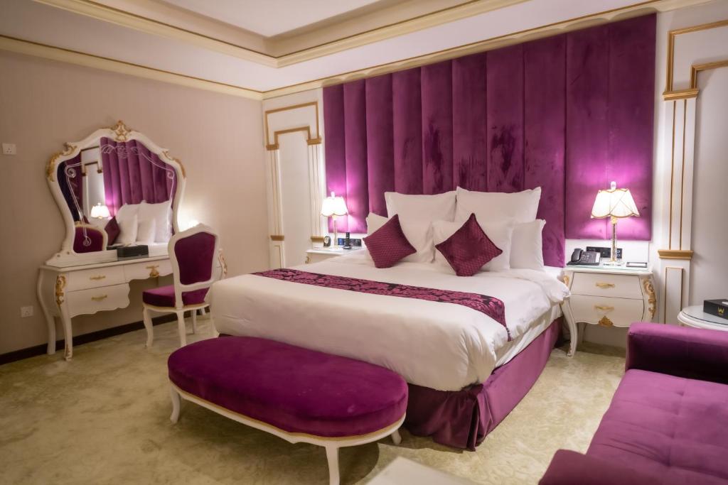 Postel nebo postele na pokoji v ubytování WA Hotel