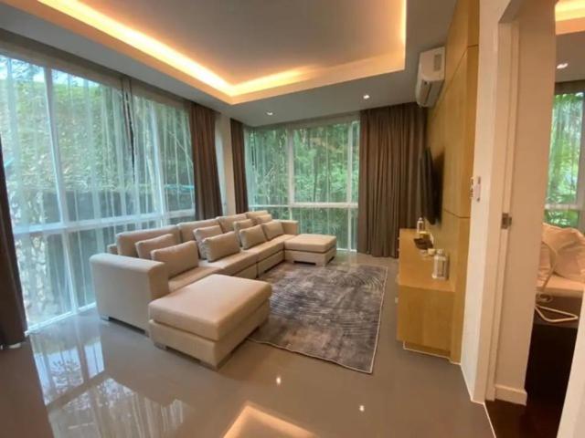 a large living room with a couch and chairs at Tropical 1bedroom Apartment in Kamala Beach