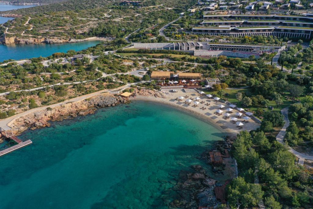 an aerial view of a beach with a resort at Six Senses Kaplankaya in Akbük