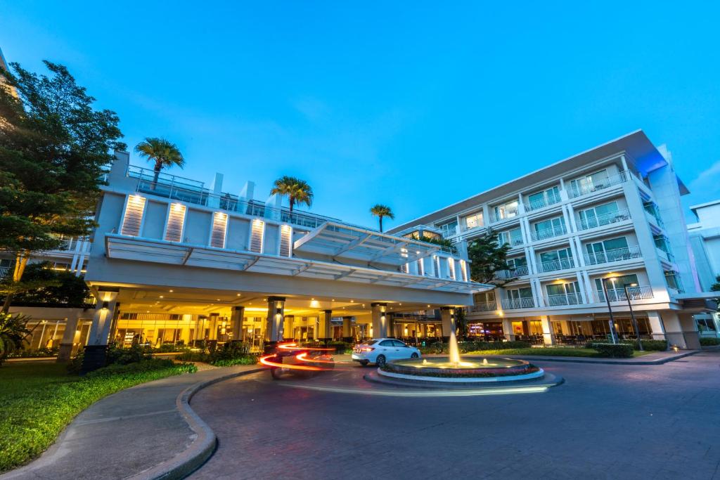 a large building with cars driving down a street at Kantary Hills Hotel, Chiang Mai in Chiang Mai