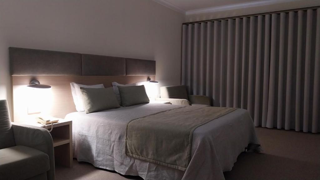 Cama ou camas em um quarto em Hotel Santa Maria