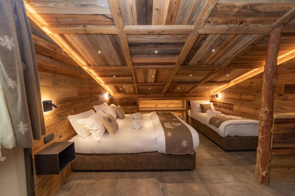 Postel nebo postele na pokoji v ubytování Avalanche - Alpine Boutique Hotel
