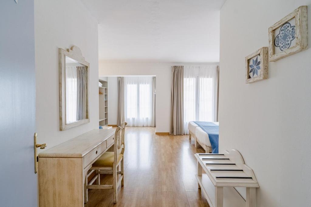 Voodi või voodid majutusasutuse Hostal HPC Porto Colom toas