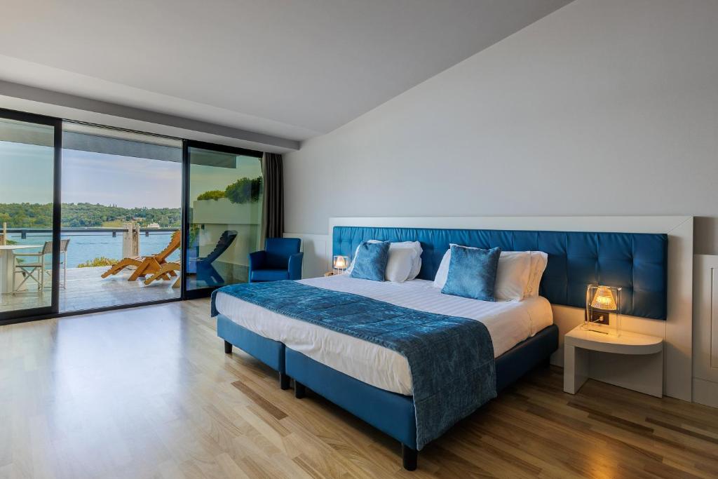 Postel nebo postele na pokoji v ubytování Hotel Salò du Parc