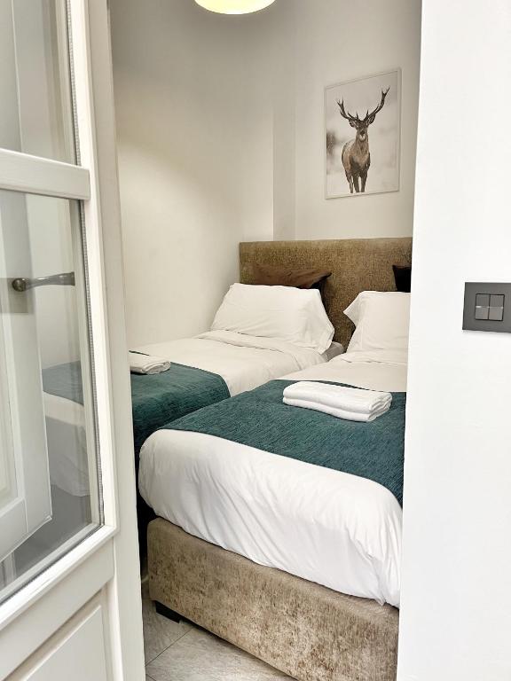 Posteľ alebo postele v izbe v ubytovaní Tennessee Urban Suites