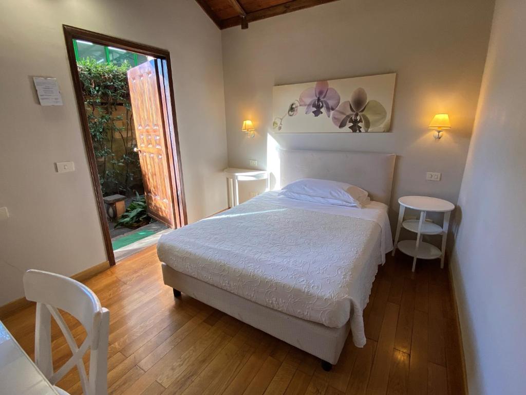 Postel nebo postele na pokoji v ubytování Antica Locanda Palmieri