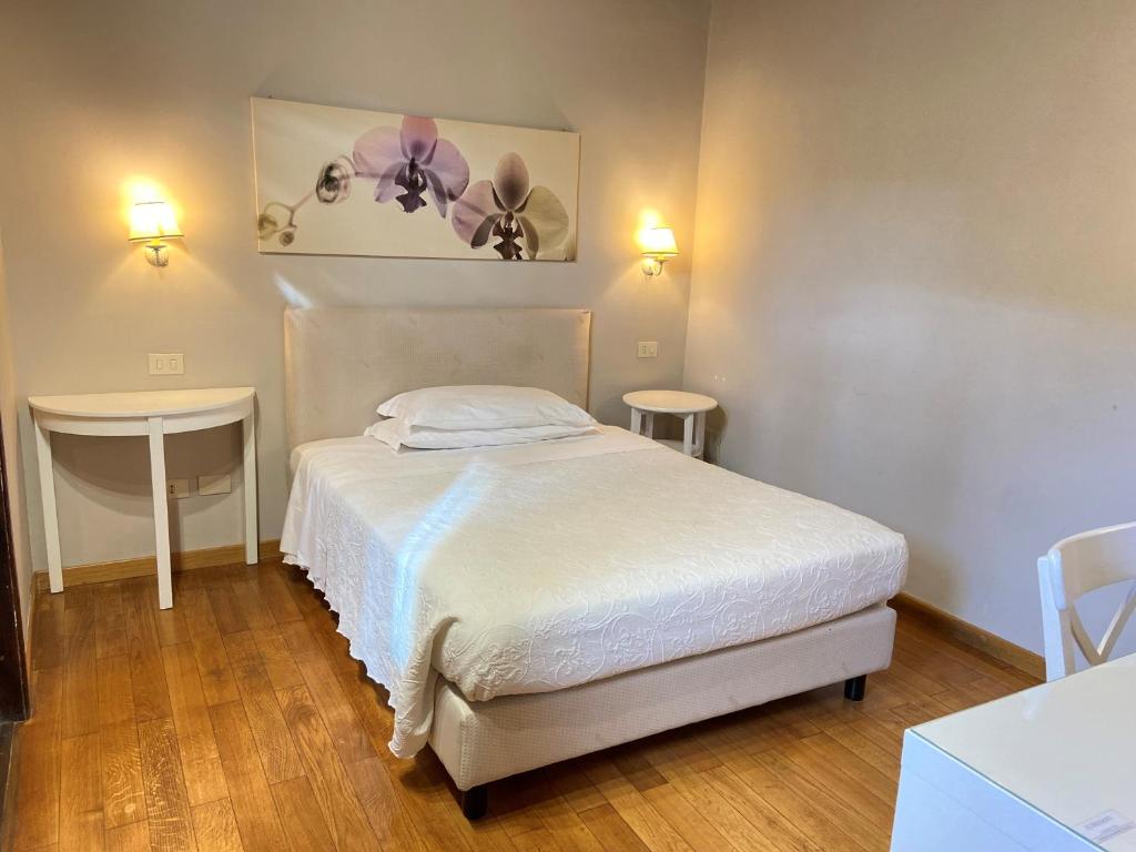 Postel nebo postele na pokoji v ubytování Antica Locanda Palmieri