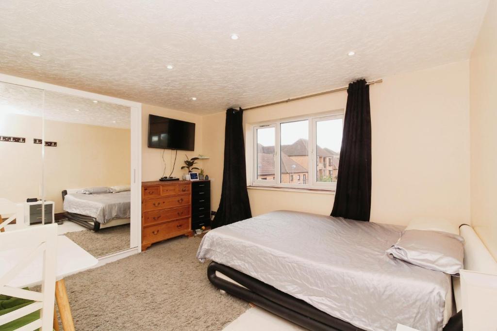 a bedroom with a bed and a window at ExCel London - University of East London - O2 Arena in London
