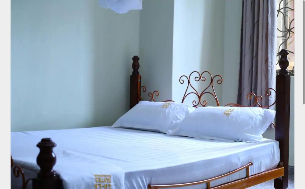 Posteľ alebo postele v izbe v ubytovaní Là-Ls' Suites