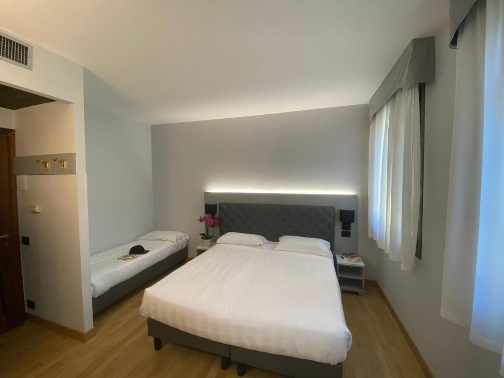 Postel nebo postele na pokoji v ubytování Park Hotel Villa Giustinian