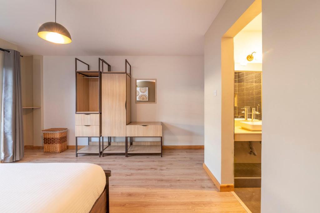 Postel nebo postele na pokoji v ubytování Tulia Villas, 3 and 4 bedroom Villas, Champagne Ridge