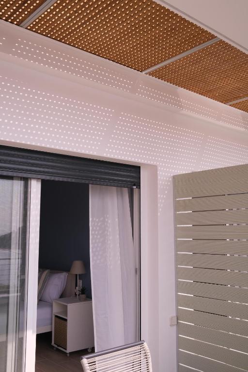 Postel nebo postele na pokoji v ubytování Villa Yolanda 2 - Luxury stylish studio Dora, sea view