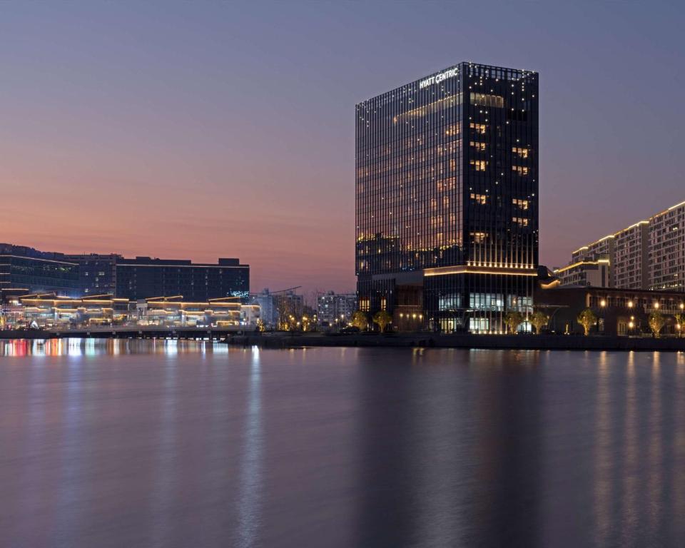 a view of a city with a large building at Hyatt Centric Lakeside Ningbo in Ningbo