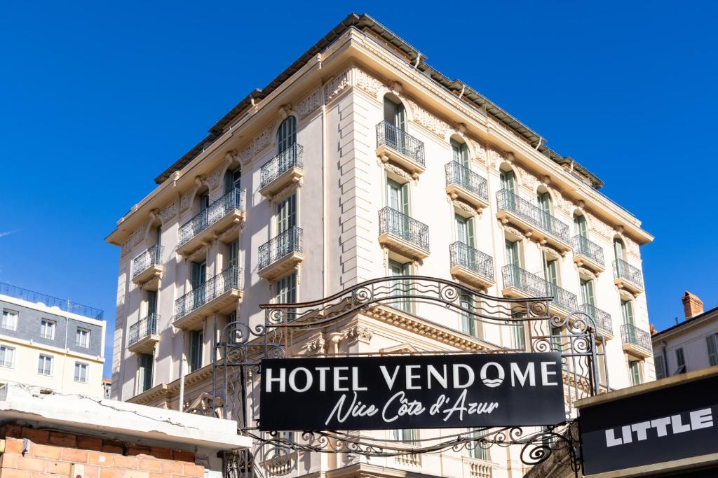 a hotel venue sign in front of a building at Hôtel Vendôme in Nice