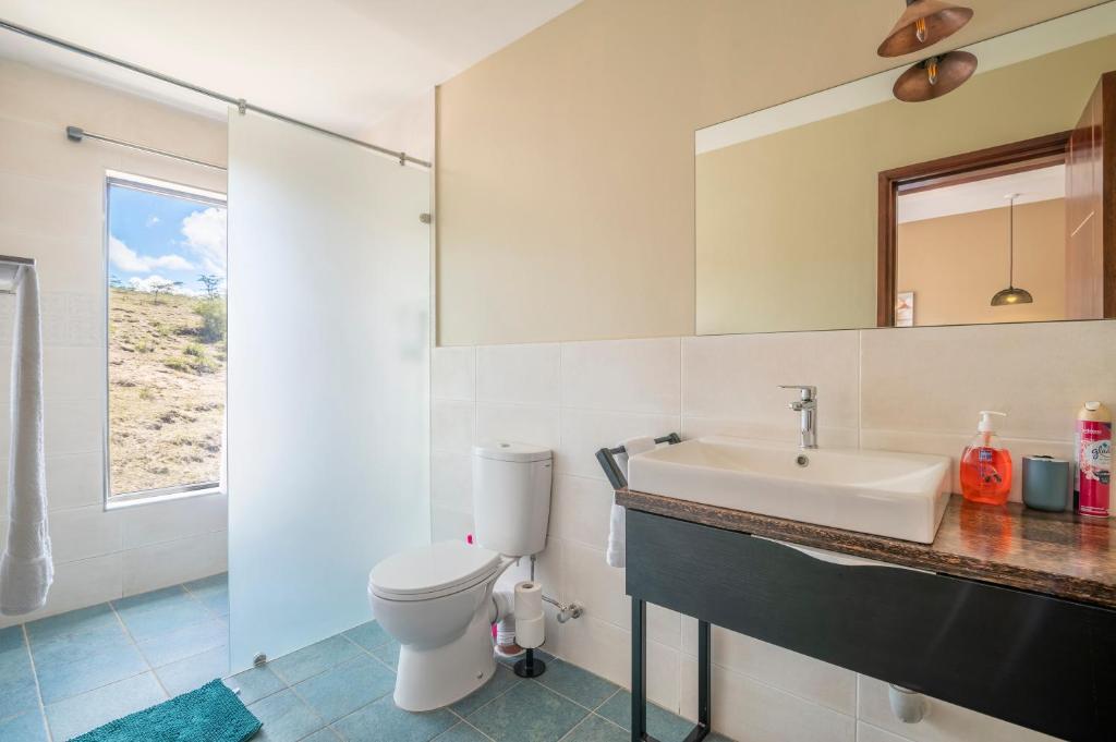Koupelna v ubytování Tulia Villas, 3 and 4 bedroom Villas, Champagne Ridge
