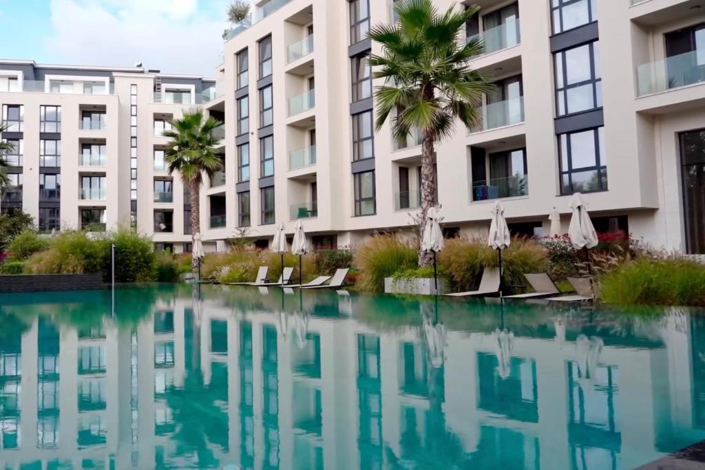 a pool of water in front of a building at Exclusive St Constantine Suites in Saints Constantine and Helena